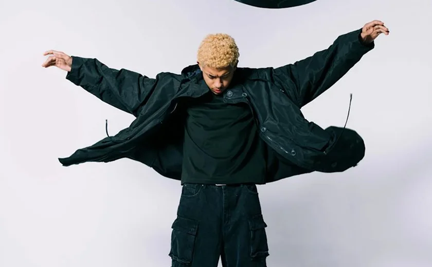 Model with arms open like wings