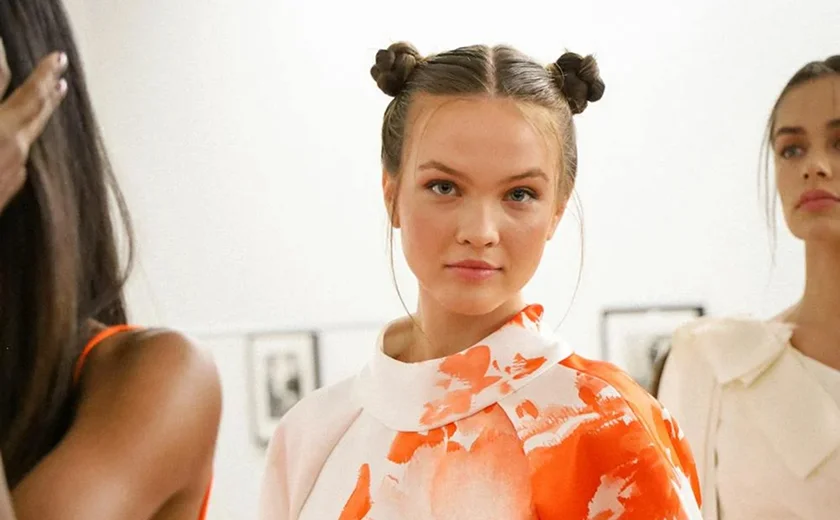 Models posing in colorful dresses